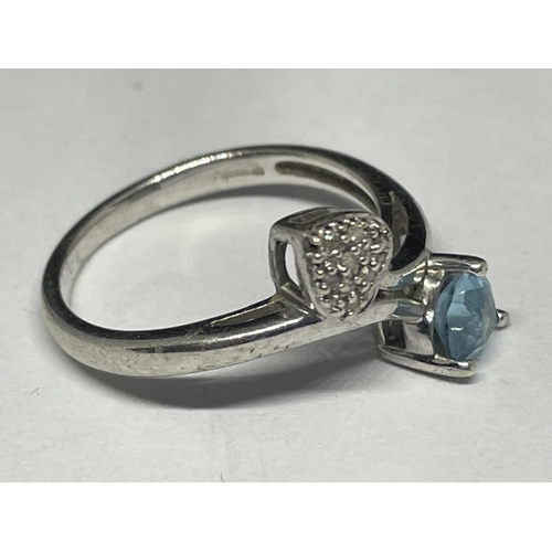 727 - A 9 CARAT GOLD RING WITH A HEART SHAPED AQUAMARINE AND DIAMONDS SIZE N