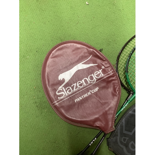 1003 - TWO BADMINTON RAQUETS WITH COVERS