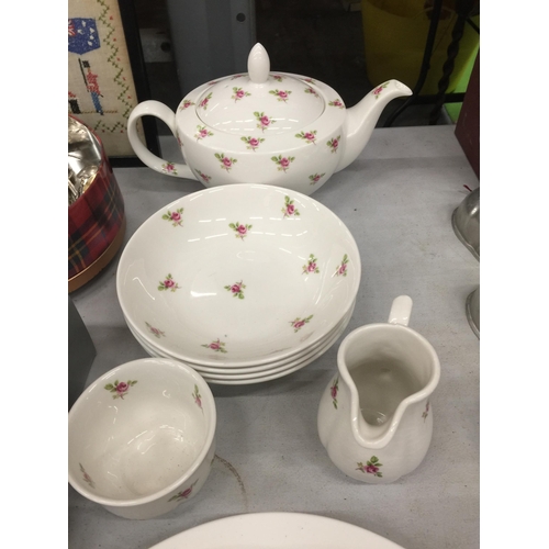 1031 - A QUANTITY OF CHINA TEAWARE TO INCLUDE PLATES, BOWLS, A TEAPOT, CREAM JUG AND SUGAR BOWL