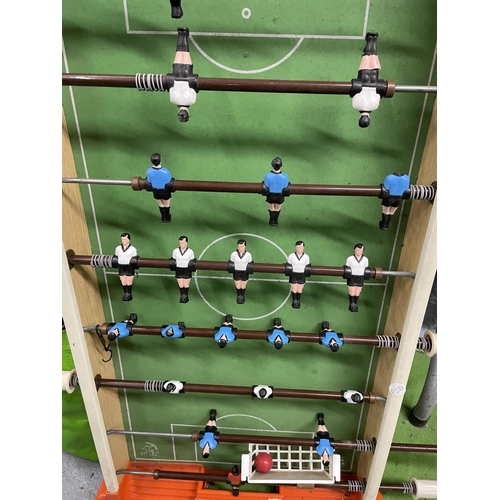 1099 - A VINTAGE TABLE SOCCER GAME - ONE PLAYER HAS LOST HIS HEAD, WIDTH 45CM, LENGTH APPROX 89CM