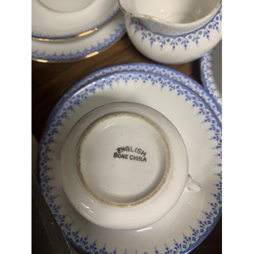 1162 - A QUANTITY OF CHINA CUPS, SAUCERS, SIDE PLATES, A SUGAR BOWL AND CREAM JUG