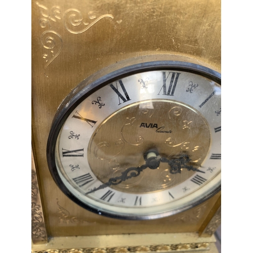 1256 - A VINTAGE GILT MANTLE CLOCK