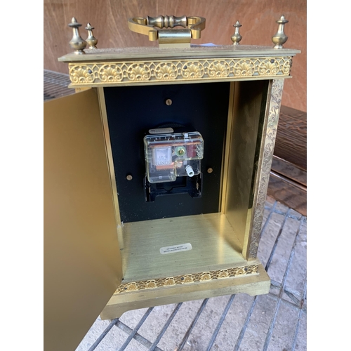 1256 - A VINTAGE GILT MANTLE CLOCK