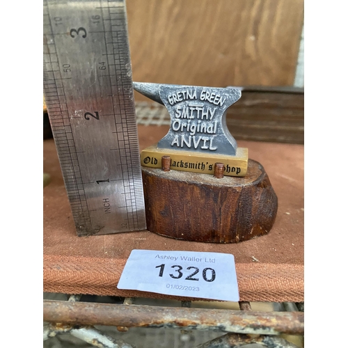 1320 - A RESIN SAMPLE GRETNA GREEN ANVIL WITH WOODEN LOG BASE