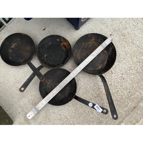 1365 - FOUR VINTAGE CAST METAL FRYING PANS