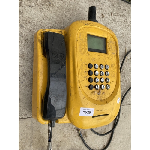 1528 - A WALL MOUNTED TAXI PAY PHONE