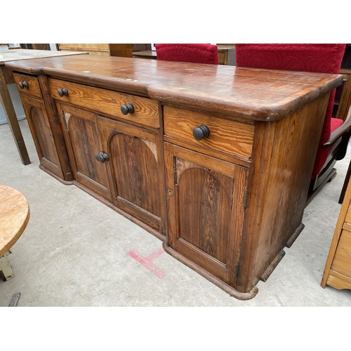 2318 - A VCITORIAN PINE BREAKFRONT KITCHEN DRESSER ENCLOSING FOUR ARCHED PANEL DOORS AND THREE DRAWERS, 75