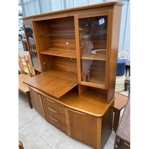 2387 - A RETRO TEAK LOUNGE UNIT WITH COCKTAIL SECTION, TWO GLASS CABINETS, CUPBOARDS AND DRAWERS TO THE BAS... 