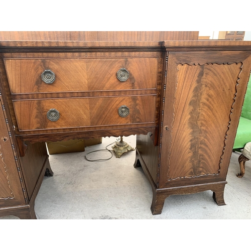 2475 - AN EDWARDIAN MAHOGANY PEDESTAL BREAKFRONT SIDEBOARD ENCLOSING TWO CUPBOARDS, ONE BEING A CELLARETTE ... 