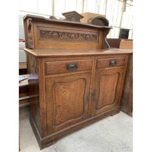 2484 - AN OAK ART NOUVEAU INFLUENCE SIDEBOARD WITH RAISED BACK, TWO DRAWERS AND TWO CUPBOARDS, 47