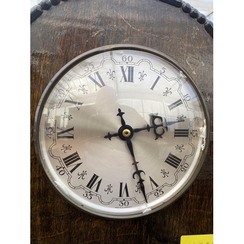 2512 - AN OAK GRANDMOTHER CLOCK WITH QUARTZ MOVEMENT