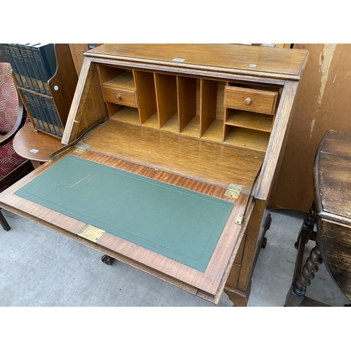 2635 - A MID 20TH CENTURY WALNUT BUREAU ON CABRIOLE LEGS, WITH BALL AND CLAW FEET, 30