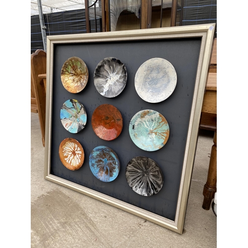 2702 - NINE ORNAMENTAL PLATES MOUNTED IN FRAME 42