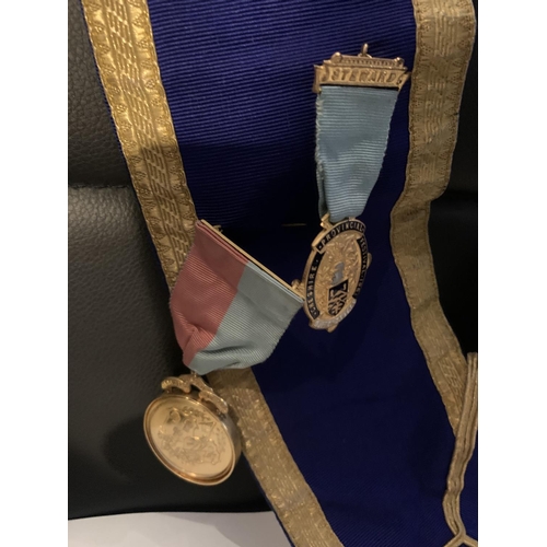 565 - A MASONIC SASH WITH HALLMARKED SILVER GILT FOB CHESHIRE FOB, FURTHER GILT MEDALS ETC