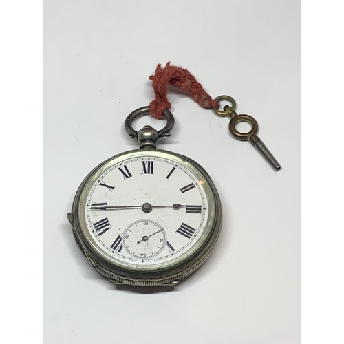 561 - A .900 GRADE SILVER OPEN FACED POCKET WATCH WITH KEY