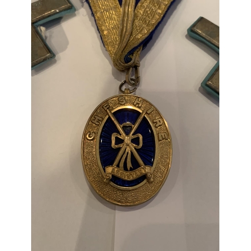 565 - A MASONIC SASH WITH HALLMARKED SILVER GILT FOB CHESHIRE FOB, FURTHER GILT MEDALS ETC