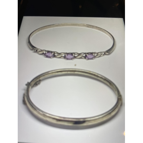 581 - TWO MARKED SILVER BANGLES