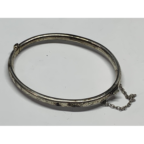 581 - TWO MARKED SILVER BANGLES