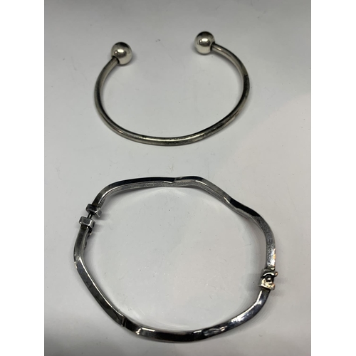 597 - TWO SILVER BANGLES