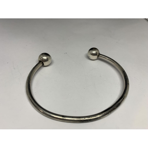 597 - TWO SILVER BANGLES