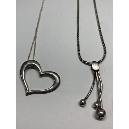 618 - FOUR SILVER NECKLACES WITH PENDANTS