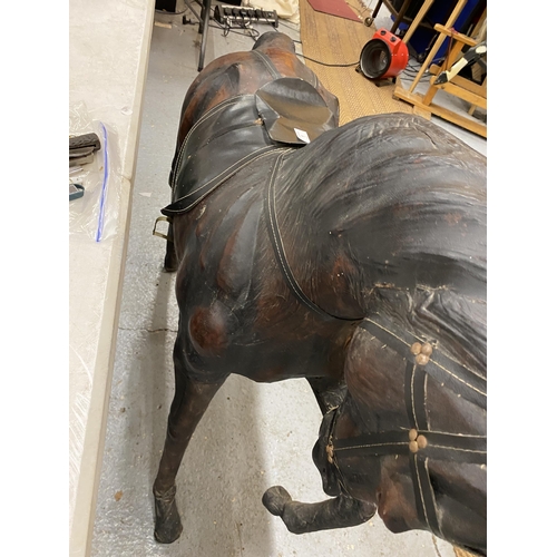 1 - A LARGE VINTAGE LIBERTY STYLE LEATHER COVERED HORSE, HEIGHT 100CM, LENGTH 122CM