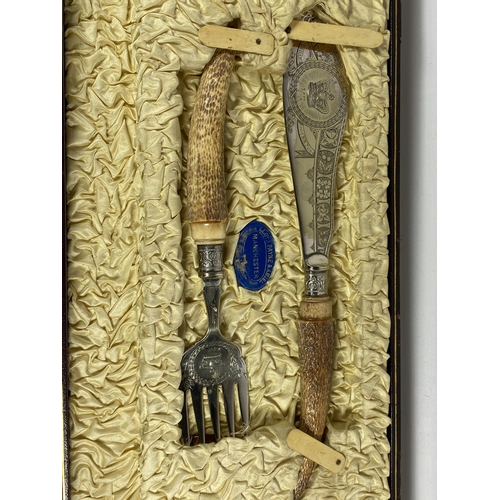 23 - A VINTAGE LLOYD PAYNE & AMIEL, MANCHESTER CARVING SET WITH SHEFFIELD HALLMARKED SILVER FERRULES