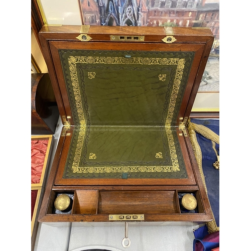 44 - A VINTAGE MAHOGANY AND BRASS BOUND WRITING SLOPE WITH GREEN LEATHER INTERIOR AND BRASS AND BLUE GLAS... 