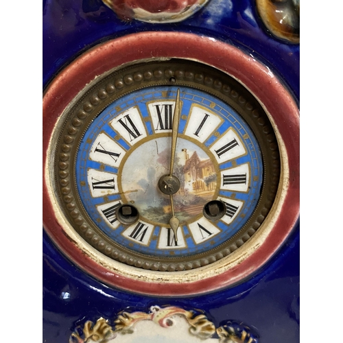 67 - A VINTAGE CONTINENTAL POTTERY CLOCK WITH HAND PAINTED DIAL, HEIGHT 33CM