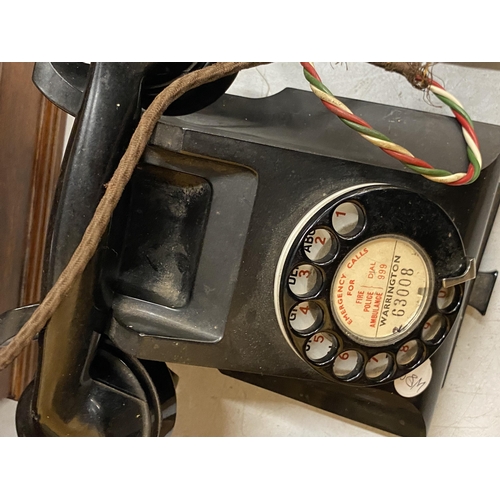 73 - A VINTAGE BLACK BAKELITE TELEPHONE