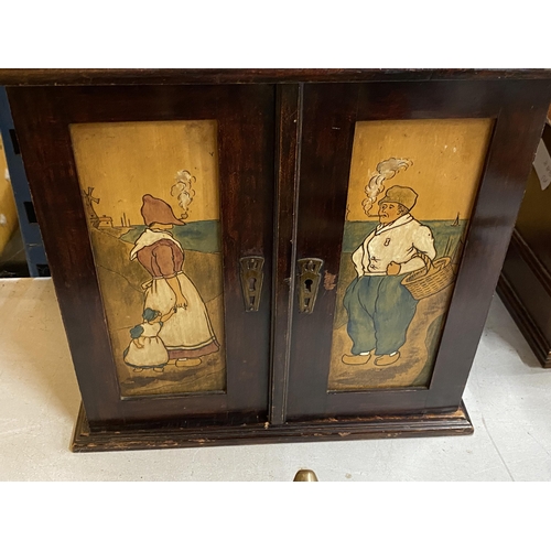 75 - AN ARTS & CRAFTS MAHOGANY SMOKERS CABINET WITH FOLD OUT DOORS AND INNER COMPARTMENTS, HEIGHT 32CM