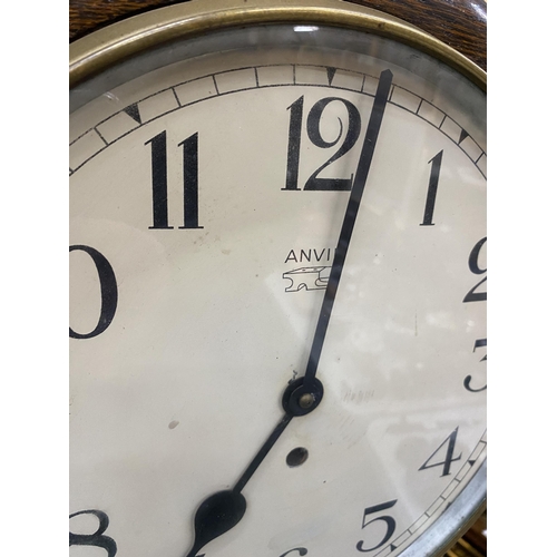 81 - A VINTAGE ANVIL ENGLISH RAILWAY CLOCK WITH KEY & PENDULUM