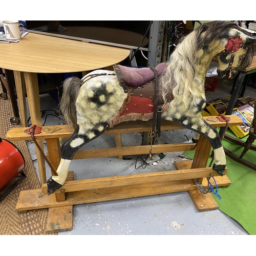 83 - A VINTAGE WOODEN ROCKING HORSE, LENGTH 129CM