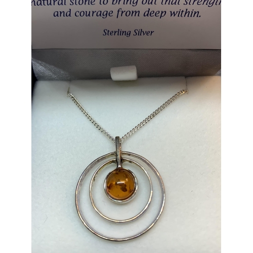 687 - A SILVER AND AMBER NECKLACE