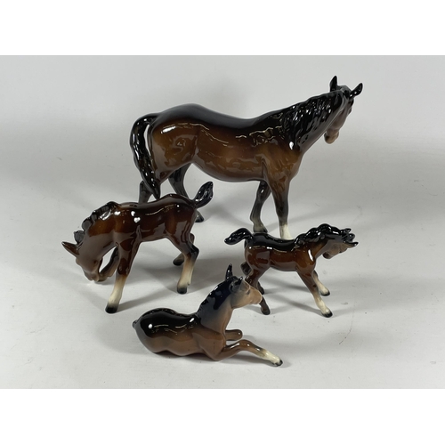 758 - A MIXED LOT OF THREE BESWICK HORSES AND A FURTHER GERMAN EXAMPLE