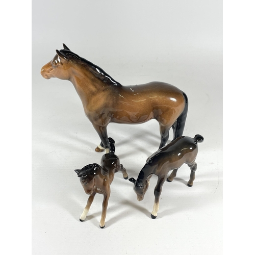 791 - A BESWICK NEW FOREST BROWN GLOSS HORSE MODEL AND TWO FOALS