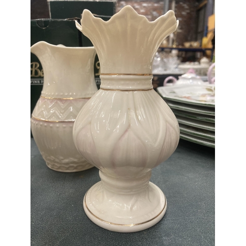 106 - THREE PIECES OF BELLEEK IN BOXES TO INCLUDE A PAIR OF 'LOTUS BLOSSOM SPILL' VASES AND A 'COLONIAL' V... 