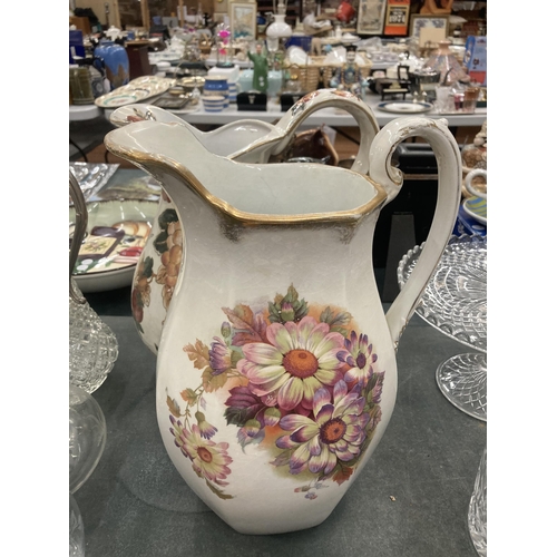 113 - TWO LARGE FLORAL VINTAGE JUGS WITH FLORAL AND FRUIT DECORATION HEIGHT 32CM