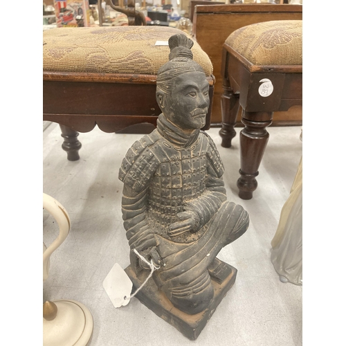 134 - A STONEWARE TERRACOTTA STYLE WARRIOR FIGURE HEIGHT 25CM