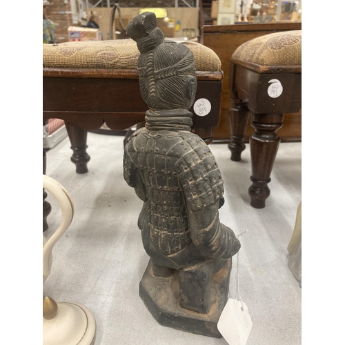 134 - A STONEWARE TERRACOTTA STYLE WARRIOR FIGURE HEIGHT 25CM