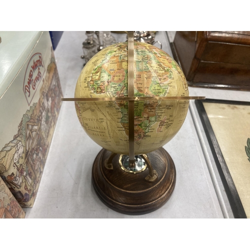 179 - A WORLD GLOBE WITH A COMPASS ON A WOODEN BASE HEIGHT APPROX 24CM