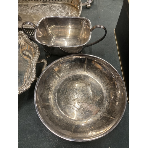 210 - A QUANTITY OF SILVER PLATED ITEMS TO INCLUDE TRAYS, A TEAPOT, HOT WATER JUG, CREAM JUG, SUGAR BOWL, ... 