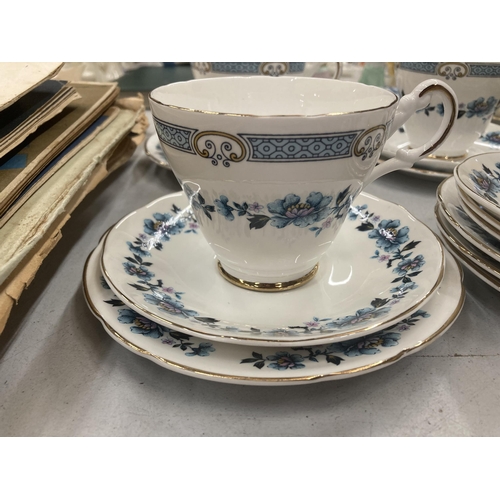 298 - A QUANTITY OF CHINA CUPS AND SAUCERS PLUS A SUGAR BOWL