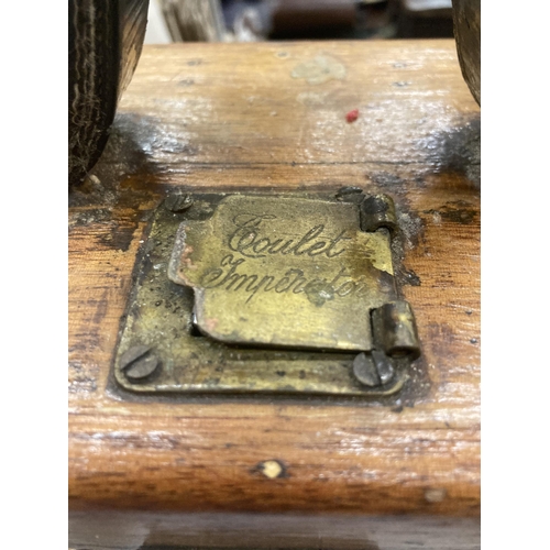 427 - A VINTAGE PIGEON RACING CLOCK IN AN OAK CASE