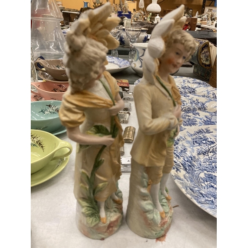 439 - A PAIR OF BISQUE CONTINENTAL FIGURES