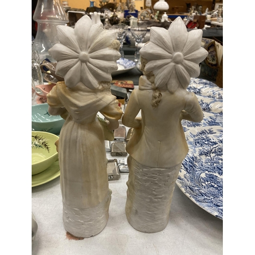 439 - A PAIR OF BISQUE CONTINENTAL FIGURES