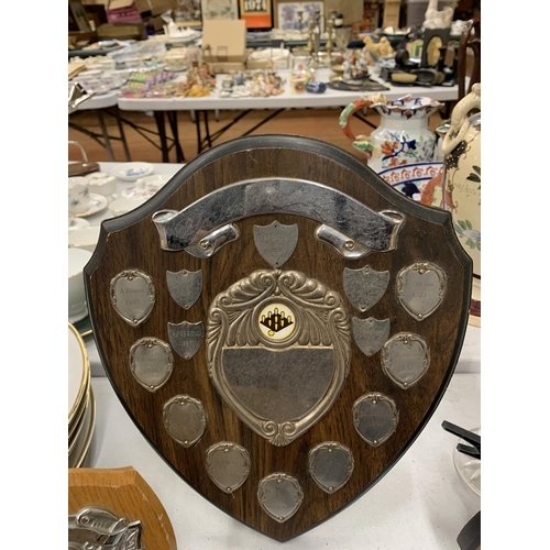 214 - A COLLECTION OF SHIELD SHAPED TROPHIES