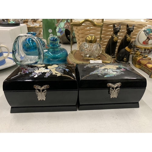 222 - TWO LACQUERED MUSICAL BOXES WITH MOTHER OF PEARL DECORATION