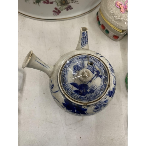 277 - AN ORIENTAL BLUE AND WHITE WATER JUG - A/F