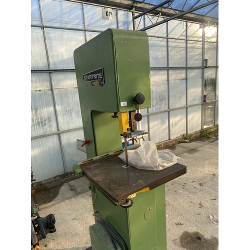 36 - AN INDUSTRIAL STARTRITE SINGLE PHASE BANDSAW COMPLETE WITH A SPARE BLADE AND FOUR WHEELED TROLLEY FO... 